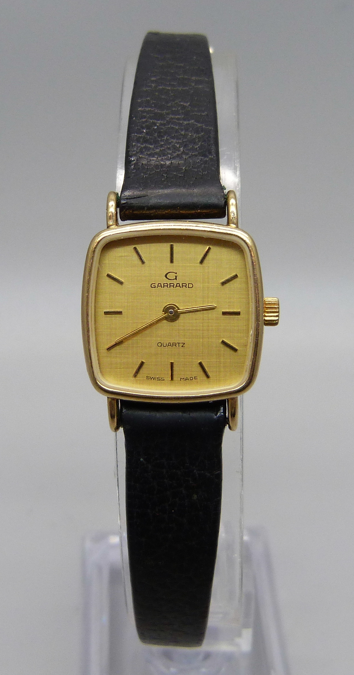 A lady'y 9ct gold cased Garrard wristwatch, cased back bears inscription