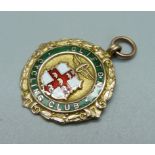 A gold and enamel cycling fob medal, 9.1g