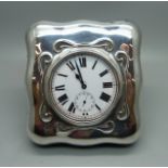 A Goliath 8-Days pocket watch in a silver fronted watch stand