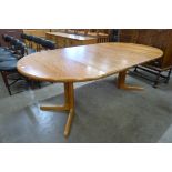 A Danish Skovby teak extending dining table