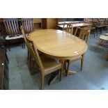 A Nathan teak extending table and four chairs