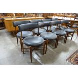 A set of eight G-Plan Fresco teak and black vinyl dining chairs