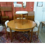 A G-Plan Fresco teak circular extending dining table and four chairs