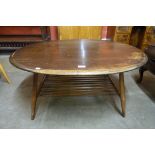 An Ercol Golden Dawn elm and beech oval Windsor coffee table