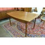 A Danish teak extending dining table