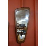 A teak asymmetrical framed mirror