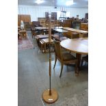 A teak standard lamp