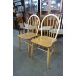 A pair of Ercol Blonde elm and beech Windsor chairs