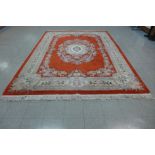 A large Chinese red ground rug, 393 x 275cms