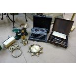 A cast iron doorstop, a set of kitchen scales and weights, typewriter, electric massage machine,
