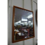 A teak framed mirror