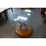 A Danish teak and glass two tier swivel coffee table