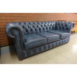 A blue leather Chesterfield settee