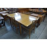A Vespa teak six piece dining suite comprising sideboard, an extending dining table and four chairs