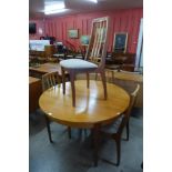 A G-Plan teak extending dining table and four teak chairs