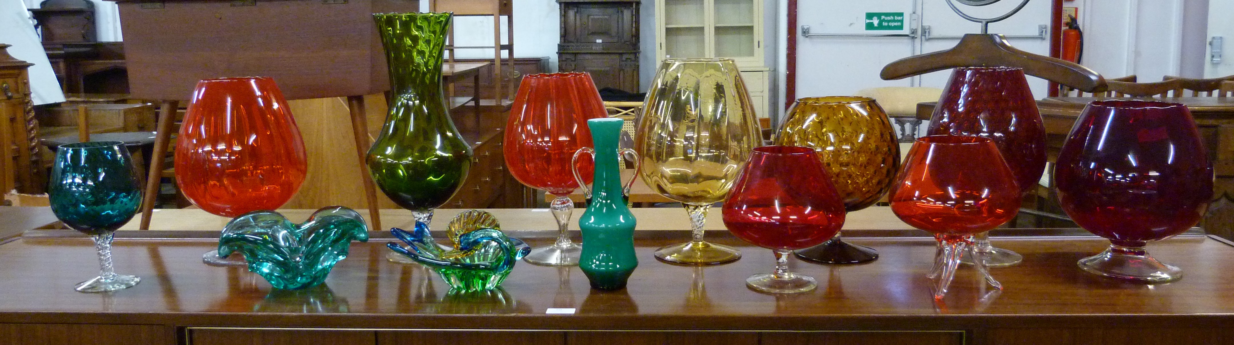 A collection of coloured glass and two items of art glass