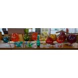 A collection of coloured glass and two items of art glass