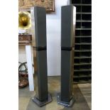 A pair of Bang & Olufsen chrome floor standing speakers