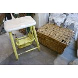 A wicker basket and a vintage step stool