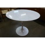 An Eero Saarinen style marble topped tulip shaped dining table