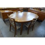 A McIntosh teak extending dining table and four teak dining chairs