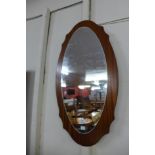 A teak framed mirror