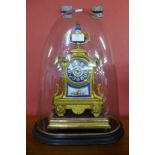 A 19th Century French gilt metal and Sevres style porcelain mantel clock, with ebonised plinth and