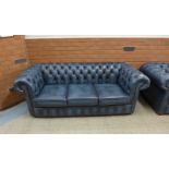 A blue leather Chesterfield settee