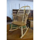 An Ercol blonde chairmakers rocking chair, model 949