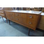 A small teak four drawer sideboard