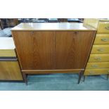 A teak two door record cabinet