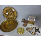 A collection of militaria, cap badges, plates, ash trays, etc.