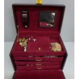 A jewellery case and contents, including two gold rings and a brooch, a silver gate bracelet and