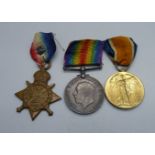 A set of three WWI medals including 1914 Mons Star to 8608 Pte. J. Davies, 1/R, W. Fus with rosette