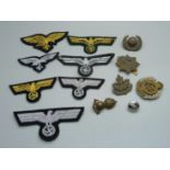 Seven German cloth insignias and military badges