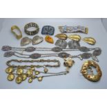 A collection of jewellery and adornments including a cut steel belt, buckles, etc.