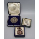 Three medallions, two to Pte. T. Taggart, Champion Recruit and Best Shot, Egypt Squad, 1936, and a