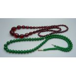 A sherry amber coloured bead necklace and a green bead necklace