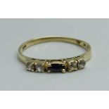 A yellow metal sapphire and white stone ring, 1.1g, J