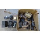 A mixed collection of cameras, includes Microcard and Rolleicord, Pentax Spotmatic, Praktica TTL,