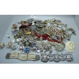 A collection of vintage costume jewellery including a large paste bracelet