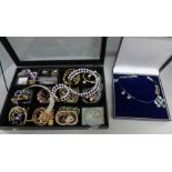 Costume jewellery and a display case