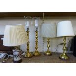 Four brass table lamps and one other
