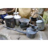 A copper coal scuttle, galvanised watering cans, etc.