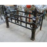 A wrought iron fire grate frame