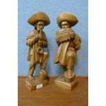 A pair of South American carved wood figures of musicians
