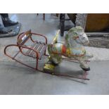 A 1950's tin-plate Mobo rocking horse