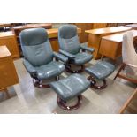 A pair of Norwegian Ekorness Stressless beech and green leather revolving lounge chairs and matching