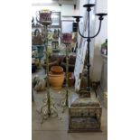 Three wrought iron candle stands and a lantern