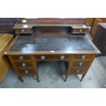 A late Victorian Warings inlaid mahogany desk